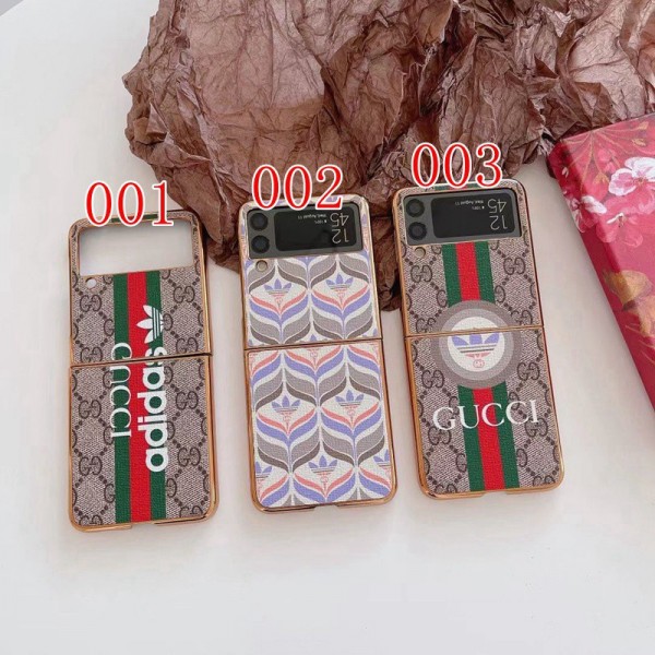 Gucci ギャラクシーz flip5/4/6スマホケース 精緻カバー グッチ コラボ アディダス galaxy z flip4携帯カバー スタイリッシュ Galaxy z flip4ケース ブランド 耐衝撃 samsung z flip3カバー 放熱性よい