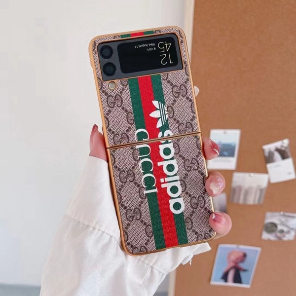 Gucci ギャラクシーz flip5/4/6スマホケース 精緻カバー グッチ コラボ アディダス galaxy z flip4携帯カバー スタイリッシュ Galaxy z flip4ケース ブランド 耐衝撃 samsung z flip3カバー 放熱性よい